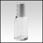 Clear roll-on bell shaped bottle with Silver cap. Silver Cap with dots. Capacity: 10 ml (1/3 oz)