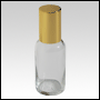 Boston round Clear glass roll on bottle with Gold cap.  Capacity : 33ml (1oz)