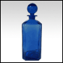 Rectangular blue glass bottle with glass stopper.  Capacity: 12oz (336ml)