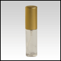 5ml (1/6oz) Clear glass cylindrical bottle with Matte Gold metal sprayer and cap.