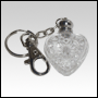 Clear white heart shaped bottle with Silver key chain cap. Capacity: 4ml (1/7oz)