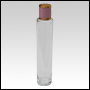 Cylindrical Slim clear glass tall bottle with Pink Leather-type cap. Capacity: Up to 102 mL (~3.45