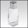 30 ml (1 oz) Clear glass diamond-shaped bottle with a Silver plastic cap.