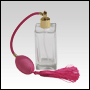Empire Glass Bottle. Pink spray pump, silver fitting and pink tassel. Capacity: 100ml (~3.5oz)