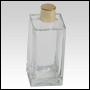 Rectangular clear glass bottle with a shiny gold cap. Capacity: 100ml (~3.5oz)