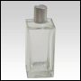 Rectangular clear glass bottle with a tall matte silver cap. Capacity: 100ml (~3.5oz)