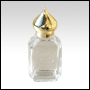Rectangular glass bottle w/Gold colored dome cap.  Capacity: 1/2oz (15ml)