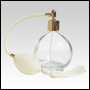 Round glass bottle with Ivory Bulb sprayer with tassel and golden fitting. Capacit