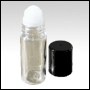 Clear glass roll on bottle with Black cap.  Capacity : 28ml (1oz)