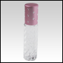 Clear glass swirl design roll on bottle with pink cap. Pink cap with silver dots.  Capacity: 9 ml