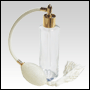 Slim glass bottle with Ivory Bulb sprayer with tassel and golden fitting. Capacity: 1 2/3oz (50ml)