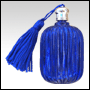 Fluted Pillow shaped Blue glass perfume bottle with Blue tasseled Silver cap. Capacity: 9ml(1/3oz) 