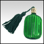 Fluted Pillow shaped green glass perfume bottle with Green tasseled Gold cap. Capacity: 9ml(1/3oz)