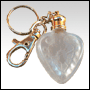 Frosted glass heart shaped bottle with Golden key chain. Capacity : 4ml(1/7oz)