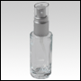 Cylindrical clear glass tall bottle with Matte Silver treatment pump and Clear over cap. Capacity: 3